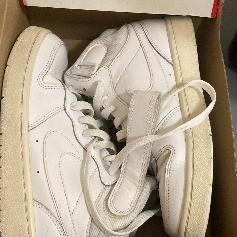 Nike White High-Top Sneakers with Subtle Off-White Sole